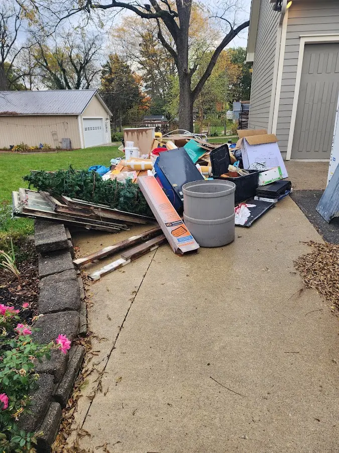 Dumpster being loaded with debris for Residential Dumpster Rental in Rutherford